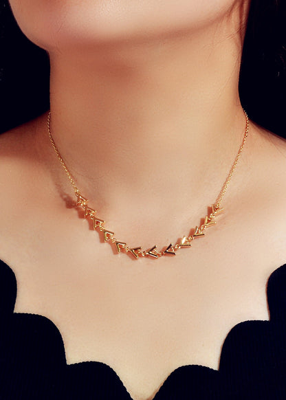 Gold Chain Arrow Charm Necklace worn on a model's neck showcasing its elegant design and charm, length 45.5cm.