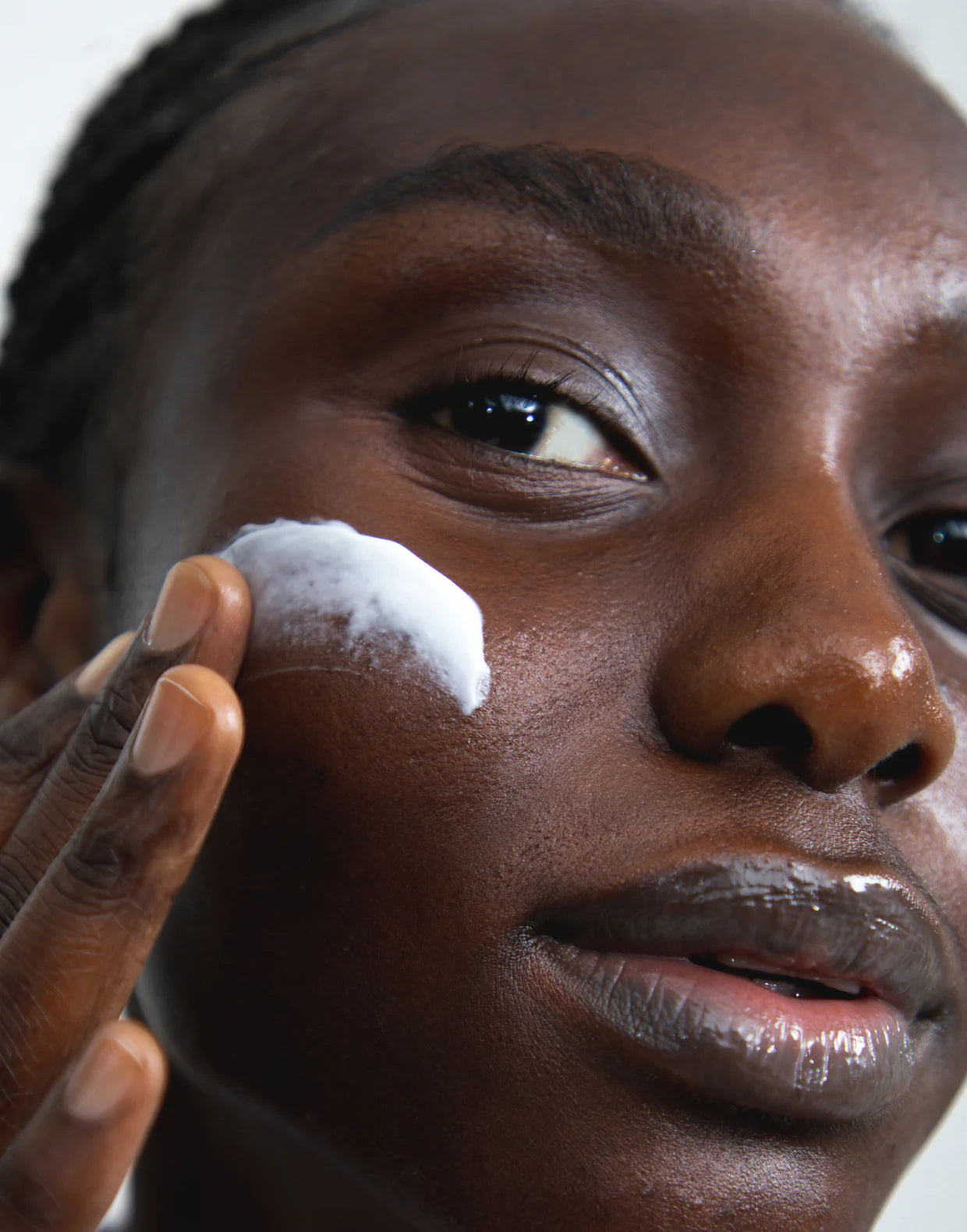 Applying Restorative Niacinamide Night Cream to deeply moisturize and rejuvenate skin.
