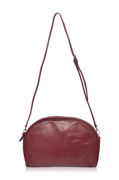 Sabine Leather Handbag in rich burgundy, featuring adjustable strap and sleek design.