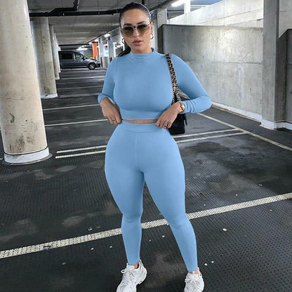 2 Piece Set Long Sleeve Solid Crop Top and Leggings in light blue worn by a model in a parking garage.