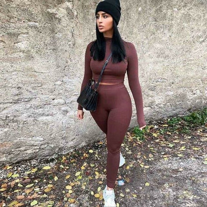 2 Piece Set Long Sleeve Solid Crop Top and Leggings worn with black hat and bag, styled for winter streetwear.