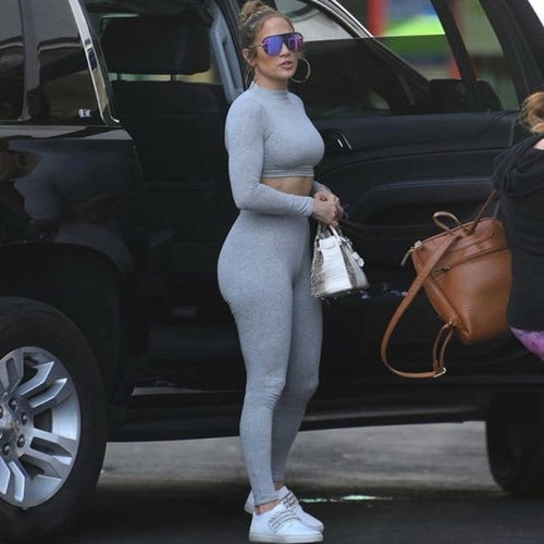2 Piece Set Long Sleeve Solid Crop Top and Leggings worn by a woman getting out of a car.