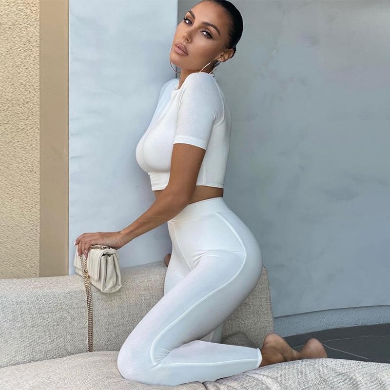 2 Piece Set Long Sleeve Solid Crop Top and Leggings model showcasing the stylish outfit in white.