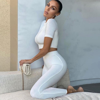 2 Piece Set Long Sleeve Solid Crop Top and Leggings model showcasing the stylish outfit in white.