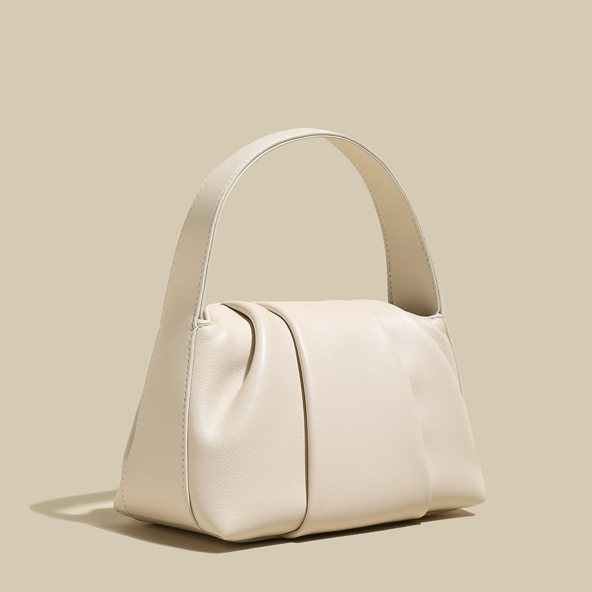 Ruched Leather Handbag showcasing elegant pleats and natural silhouette, perfect for day-to-night transitions.